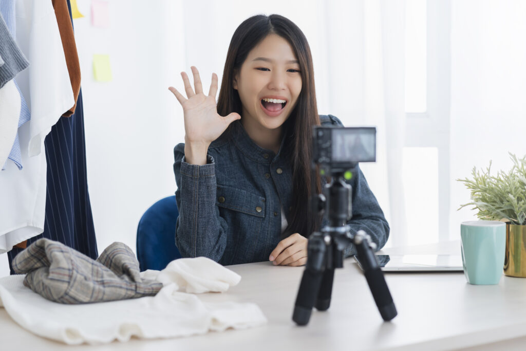 Asian beautiful asian vlogger or blogger present cloth dress online business shop online ideas concept