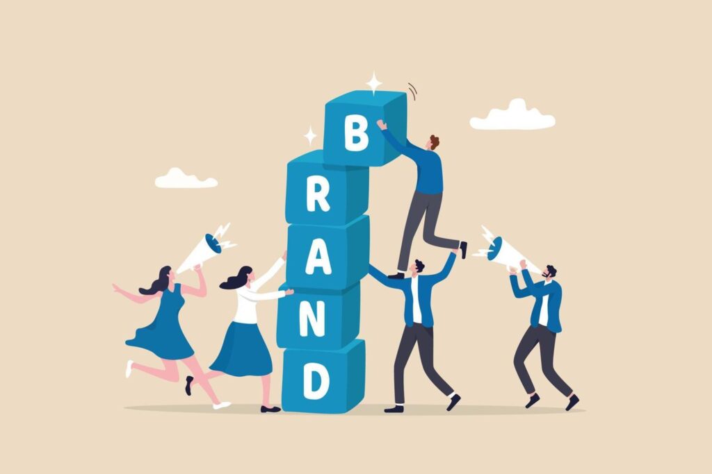 Business people help building block with the word brand
