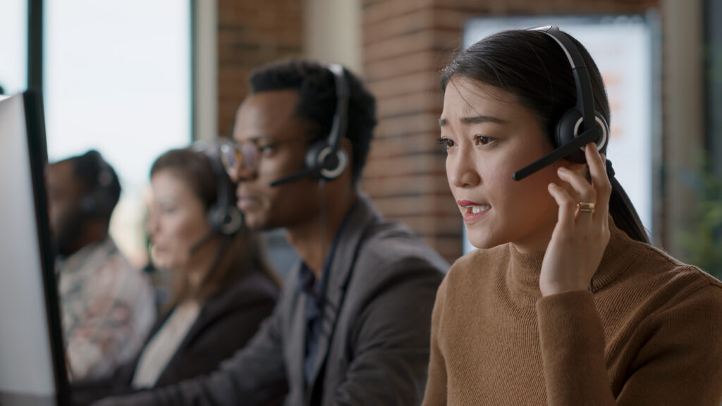 Female sales agent talking on phone call to client