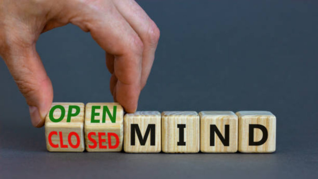 wooden blocks showing open and closed mind text