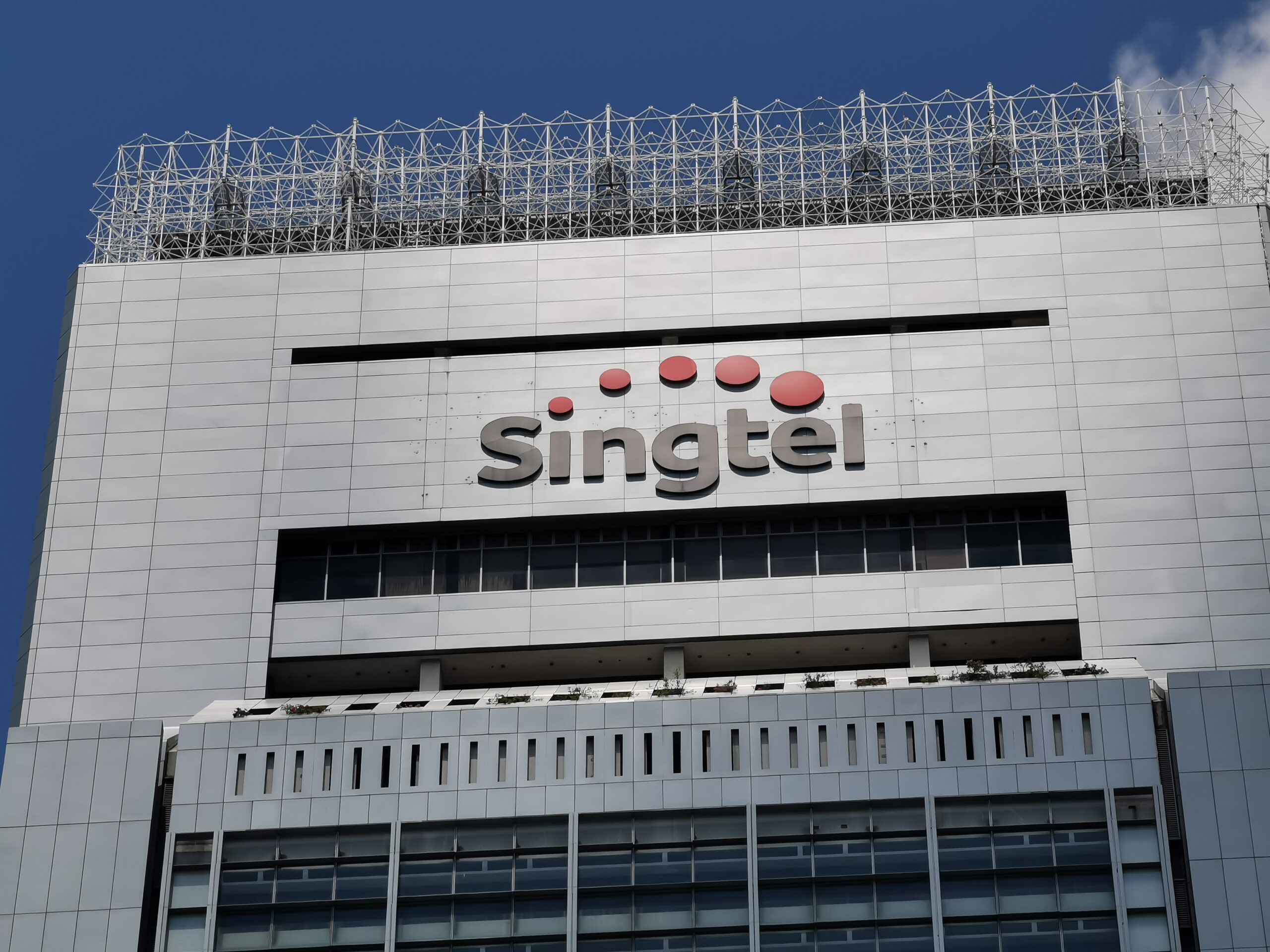 SingTel's annual profit plunges by over 50% due to a US$2.3 billion impairment charge